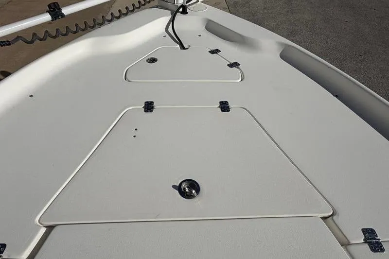 Slide: The Image of 2016 Key West 230 Bay Reef boat deck with storage compartments and wiring. - 24