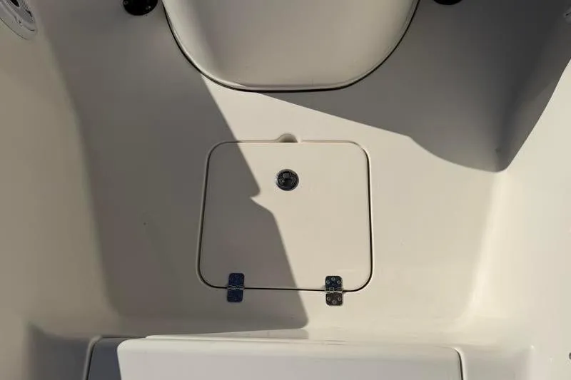 Slide: The Image of 2016 Key West 230 Bay Reef boat storage compartment with shadow. - 28