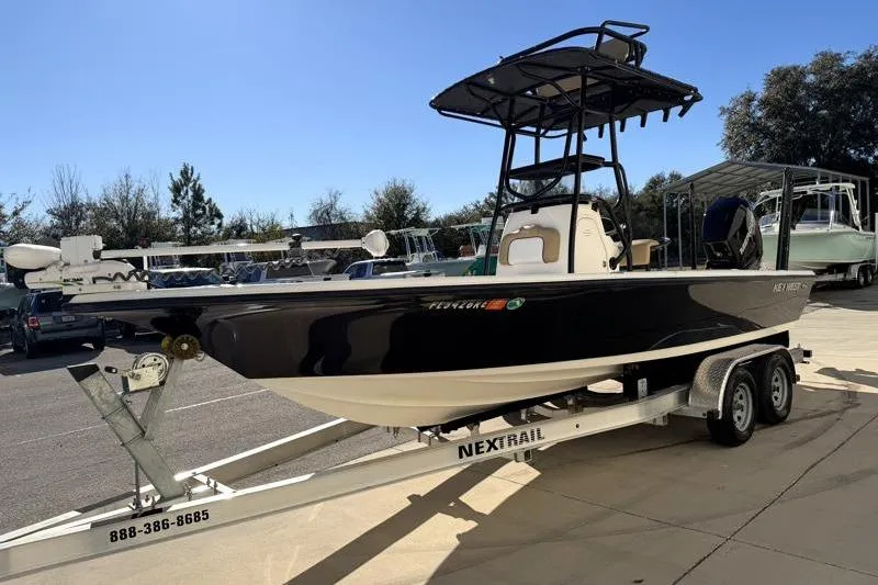 Slide: The Image of 2016 Key West 230 Bay Reef boat on trailer in outdoor setting. - 3