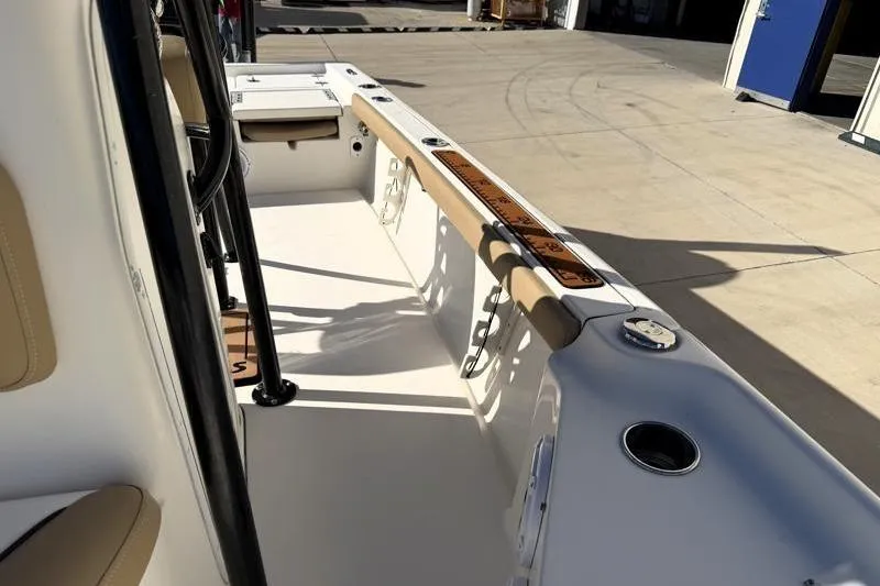 Slide: The Image of 2016 Key West 230 Bay Reef boat interior with seating and storage compartments. - 31