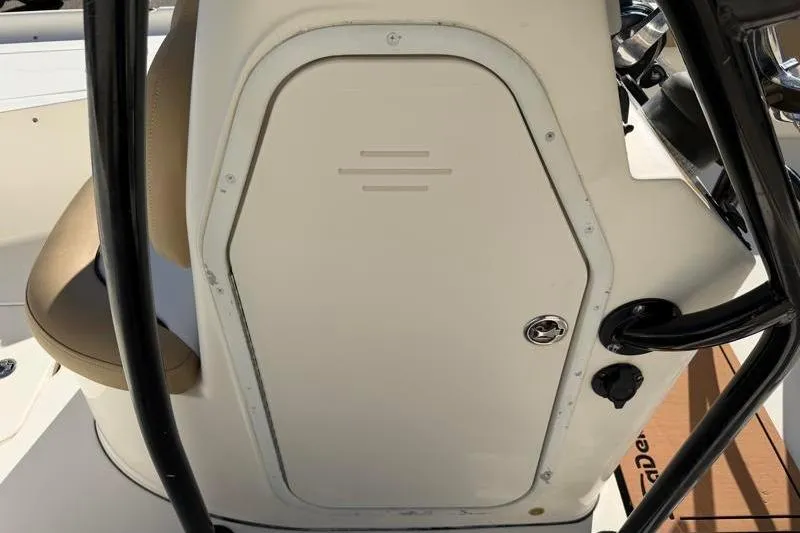 Slide: The Image of 2016 Key West 230 Bay Reef boat console with storage compartment and seating. - 33