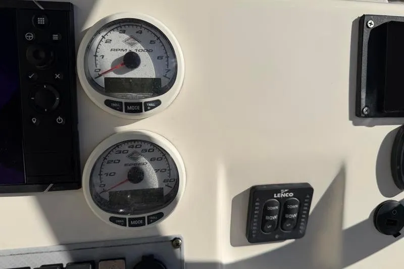 Slide: The Image of Dashboard of 2016 Key West 230 Bay Reef boat with gauges and controls. - 40