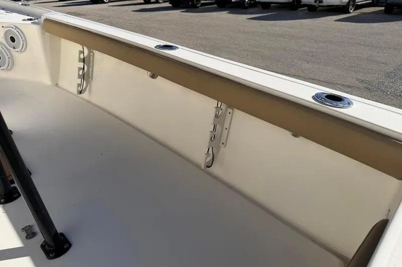 Slide: The Image of 2016 Key West 230 Bay Reef boat interior with rod holders and speakers. - 47