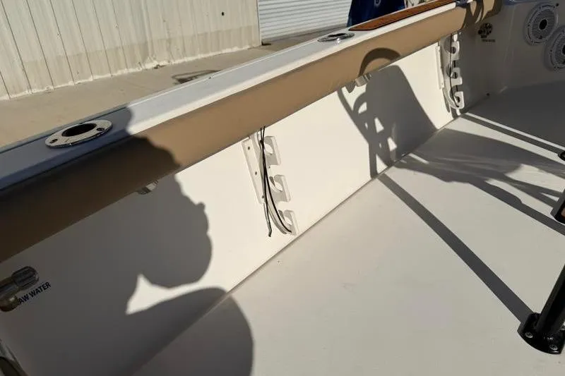 Slide: The Image of 2016 Key West 230 Bay Reef boat interior with rod holders and clean deck. - 48