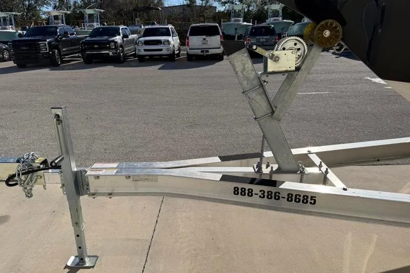 Slide: The Image of 2016 Key West 230 Bay Reef trailer in parking lot with contact number. - 54