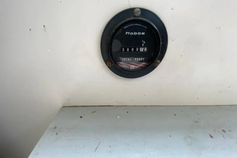 Slide: The Image of Hour meter on 1977 Bertram 28 Flybridge, displaying 3999 hours. - 23