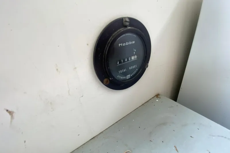 Slide: The Image of Hour meter on 1977 Bertram 28 Flybridge, displaying total engine hours. - 24