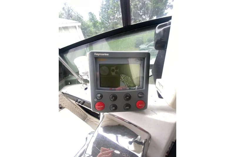 Slide: The Image of Raymarine autopilot system on 1977 Bertram 28 Flybridge boat dashboard. - 25