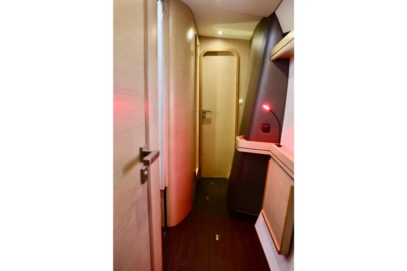 Slide: The Image of 2017 Outremer 51 yacht interior hallway with modern wood finish and ambient lighting. - 105