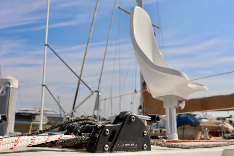 Slide: The Image of 2017 Outremer 51 sailboat deck with ropes and seating, under a clear blue sky. - 109