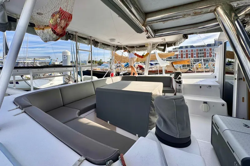 Slide: The Image of 2017 Outremer 51 yacht interior with seating and marina view. - 11
