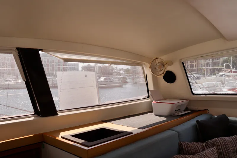 Slide: The Image of Interior view of 2017 Outremer 51 catamaran with large windows and cozy seating area. - 119