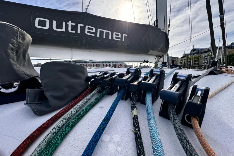Slide: The Image of 2017 Outremer 51 sailboat deck with colorful ropes and branded sail. - 14
