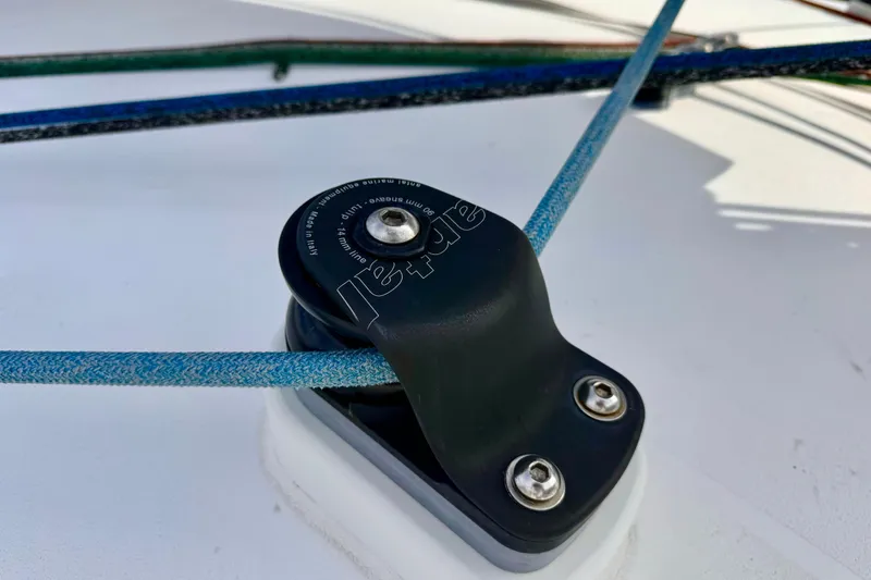 Slide: The Image of Close-up of a sailing block on a 2017 Outremer 51 catamaran deck. - 28