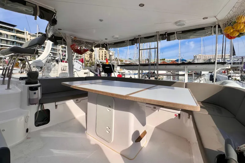 Slide: The Image of Spacious cockpit of 2017 Outremer 51 catamaran docked at marina. - 29