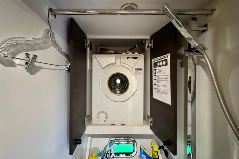 Slide: The Image of Laundry area with washing machine in 2017 Outremer 51 yacht bathroom. - 35