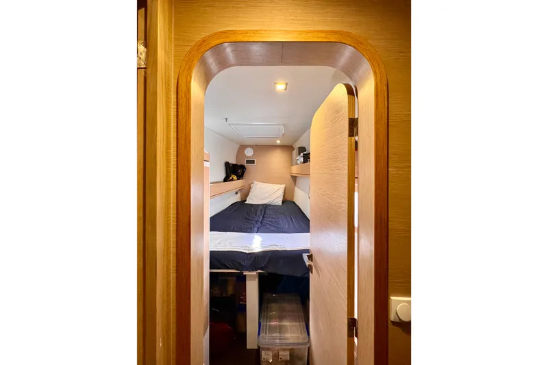 Slide: The Image of Cozy cabin interior of 2017 Outremer 51 sailboat with wooden finish and bed. - 37