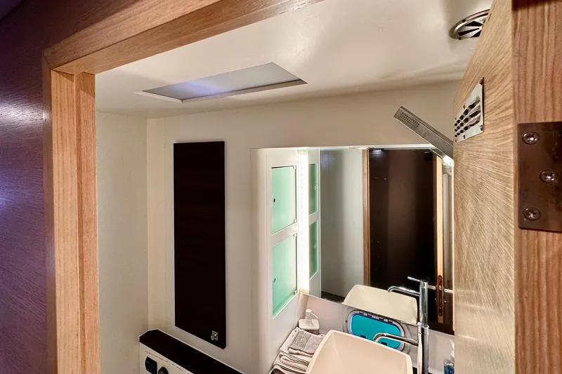 Slide: The Image of Modern bathroom interior of 2017 Outremer 51 yacht with sleek fixtures and wooden accents. - 38