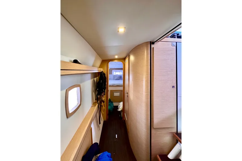 Slide: The Image of Interior hallway of 2017 Outremer 51 yacht, featuring modern wood finishes and cozy design. - 41