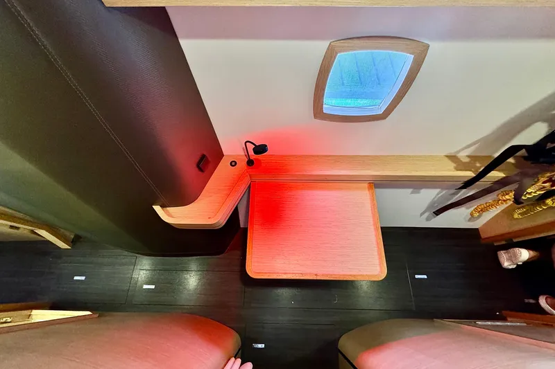 Slide: The Image of Interior of 2017 Outremer 51 yacht with modern wood accents and ambient lighting. - 43