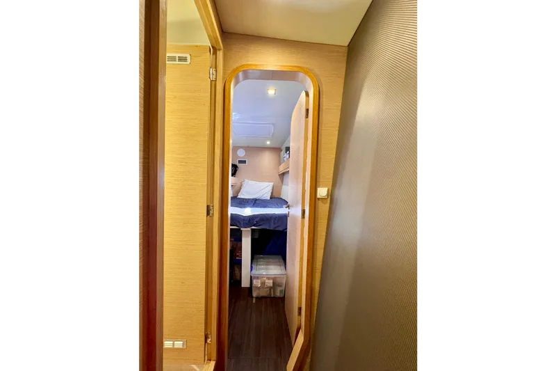 Slide: The Image of Interior view of 2017 Outremer 51 yacht cabin with bed and storage. - 46