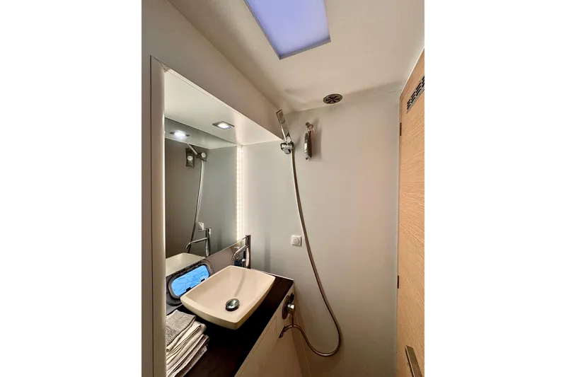 Slide: The Image of Bathroom interior of 2017 Outremer 51 yacht with modern sink and shower. - 52