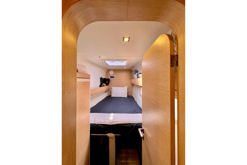 Slide: The Image of Cozy cabin interior of 2017 Outremer 51 yacht with wooden finish and skylight. - 57