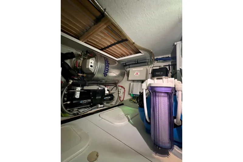 Slide: The Image of Engine room of 2017 Outremer 51 yacht with water filtration system and equipment. - 60