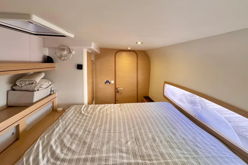 Slide: The Image of Luxurious cabin interior of 2017 Outremer 51 yacht with modern design and cozy bedding. - 62