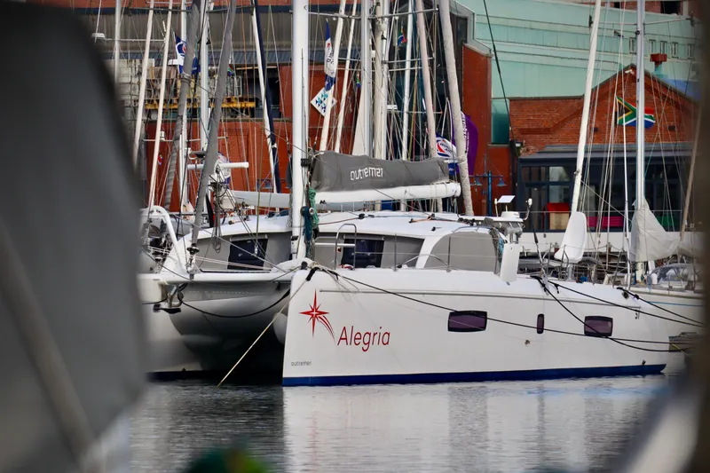Slide: The Image of 2017 Outremer 51 catamaran "Alegria" docked in a marina. - 7