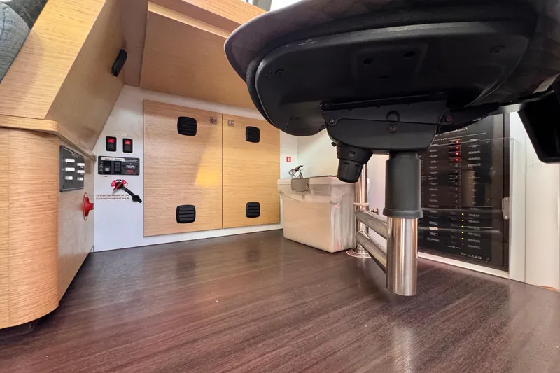 Slide: The Image of Interior of a 2017 Outremer 51 yacht, featuring control panels and storage. - 72