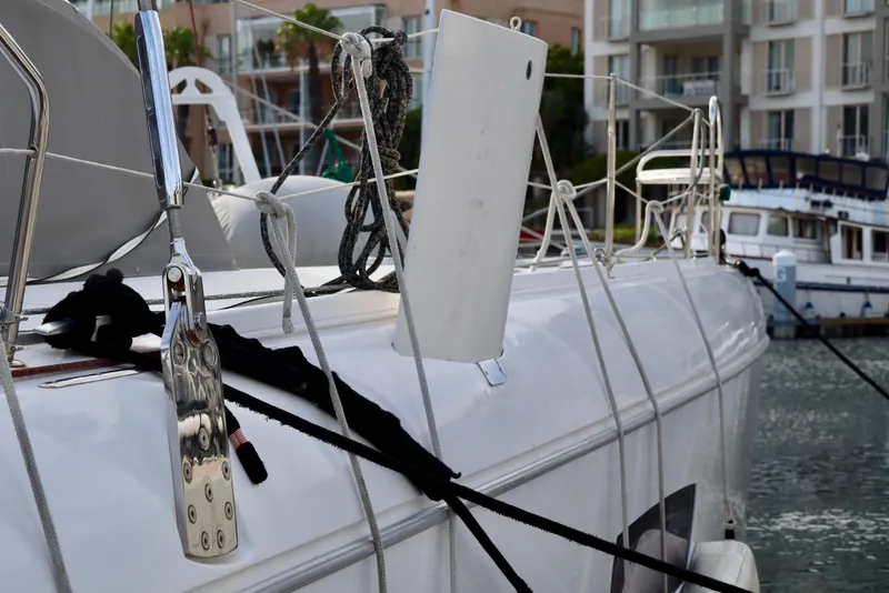 Slide: The Image of 2017 Outremer 51 yacht docked, showcasing deck details and rigging. - 82