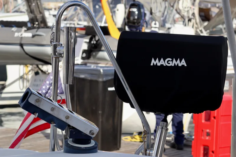 Slide: The Image of Outremer 51 sailboat (2017) with Magma grill and American flag at marina. - 84