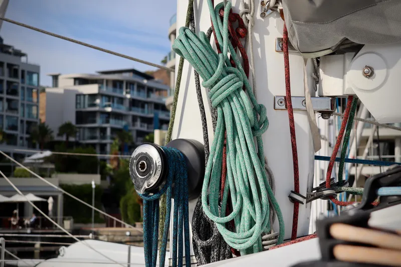 Slide: The Image of Close-up of ropes and winch on a 2017 Outremer 51 sailboat, with urban background. - 89