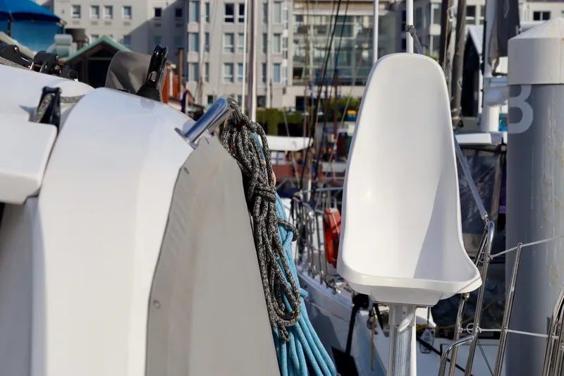 Slide: The Image of 2017 Outremer 51 yacht with ropes and seating, docked in a marina. - 90