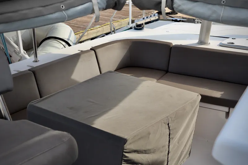 Slide: The Image of 2017 Outremer 51 yacht cockpit with cushioned seating and table. - 93