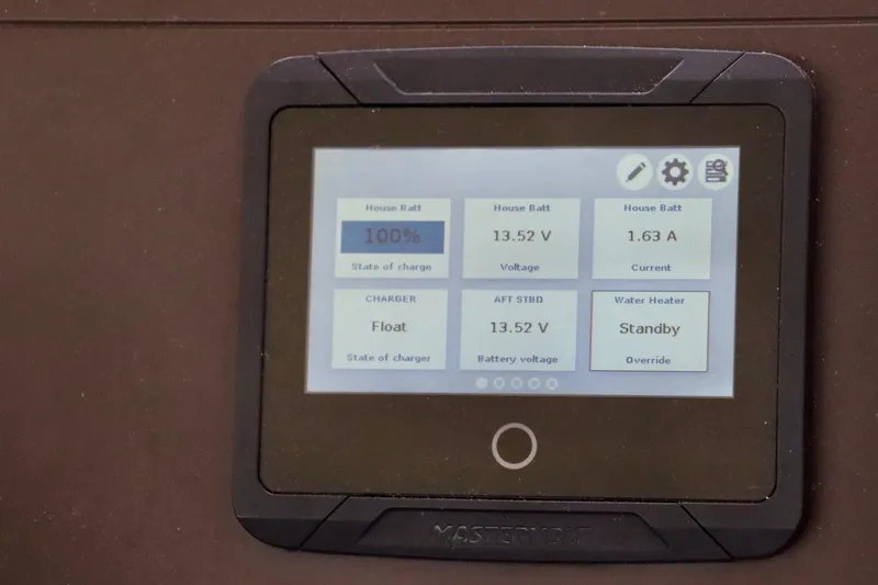Slide: The Image of Control panel display on 2017 Outremer 51 showing battery status and water heater settings. - 98