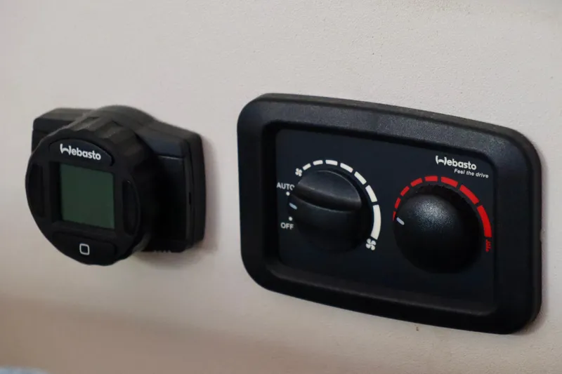 Slide: The Image of Webasto control panel on 2017 Outremer 51 yacht, featuring temperature and fan settings. - 99