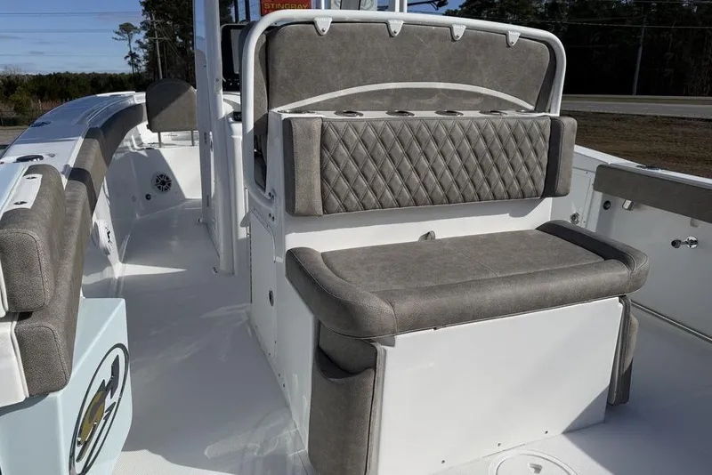 Slide: The Image of 2026 Sea Hunt Ultra 275 SE boat interior with cushioned seating and storage. - 15