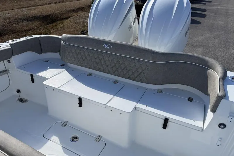 Slide: The Image of 2026 Sea Hunt Ultra 275 SE boat interior with cushioned seating and storage compartments. - 17