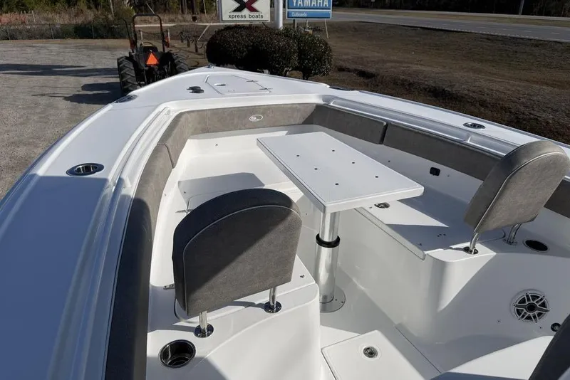 Slide: The Image of 2026 Sea Hunt Ultra 275 SE boat interior with seating and table setup. - 19