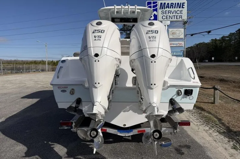 Slide: The Image of Twin 250 V6 outboard engines on a 2026 Sea Hunt Ultra 275 SE boat. - 7