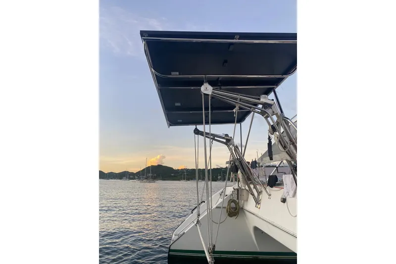 Slide: The Image of Sailboat Privilege 482, 1992 model, docked at sunset with scenic water view. - 14