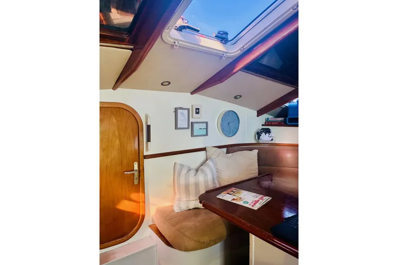 Slide: The Image of Cozy interior of 1992 Privilege 482 yacht with wooden accents and seating area. - 18
