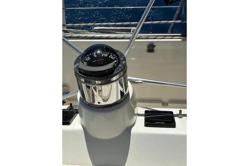 Slide: The Image of Compass on 1992 Privilege 482 yacht, with ocean view in background. - 21