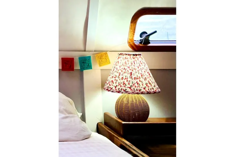 Slide: The Image of Cozy cabin interior of 1992 Privilege 482 yacht with floral lamp and colorful decor. - 31