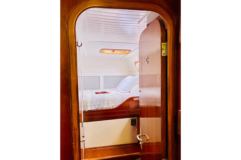 Slide: The Image of Cozy cabin interior of 1992 Privilege 482 yacht with wooden door and bed. - 33