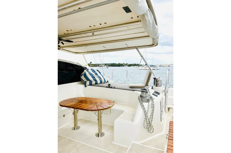 Slide: The Image of Luxury Privilege 482 yacht deck with seating, table, and ocean view, 1992 model. - 36