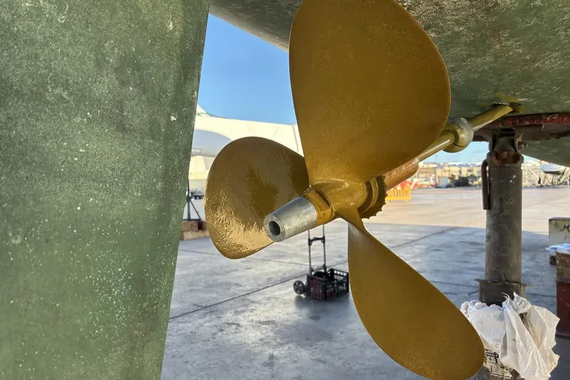 Slide: The Image of Close-up of a 1992 Privilege 482 boat propeller on dry dock. - 46