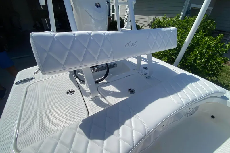 Slide: The Image of 2026 Chaos 16 Bonefish boat with white diamond-stitched seating, showcasing luxury and craftsmanship. - 10